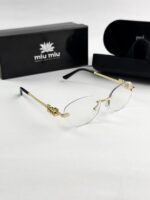 MIU MIU gold frame 1025